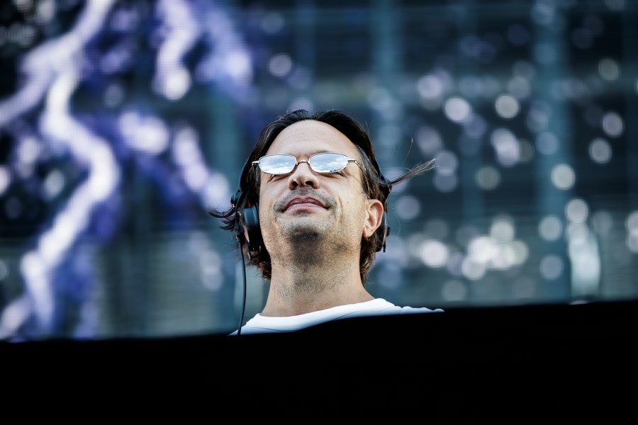 An artist looks out over the crowd from the stage